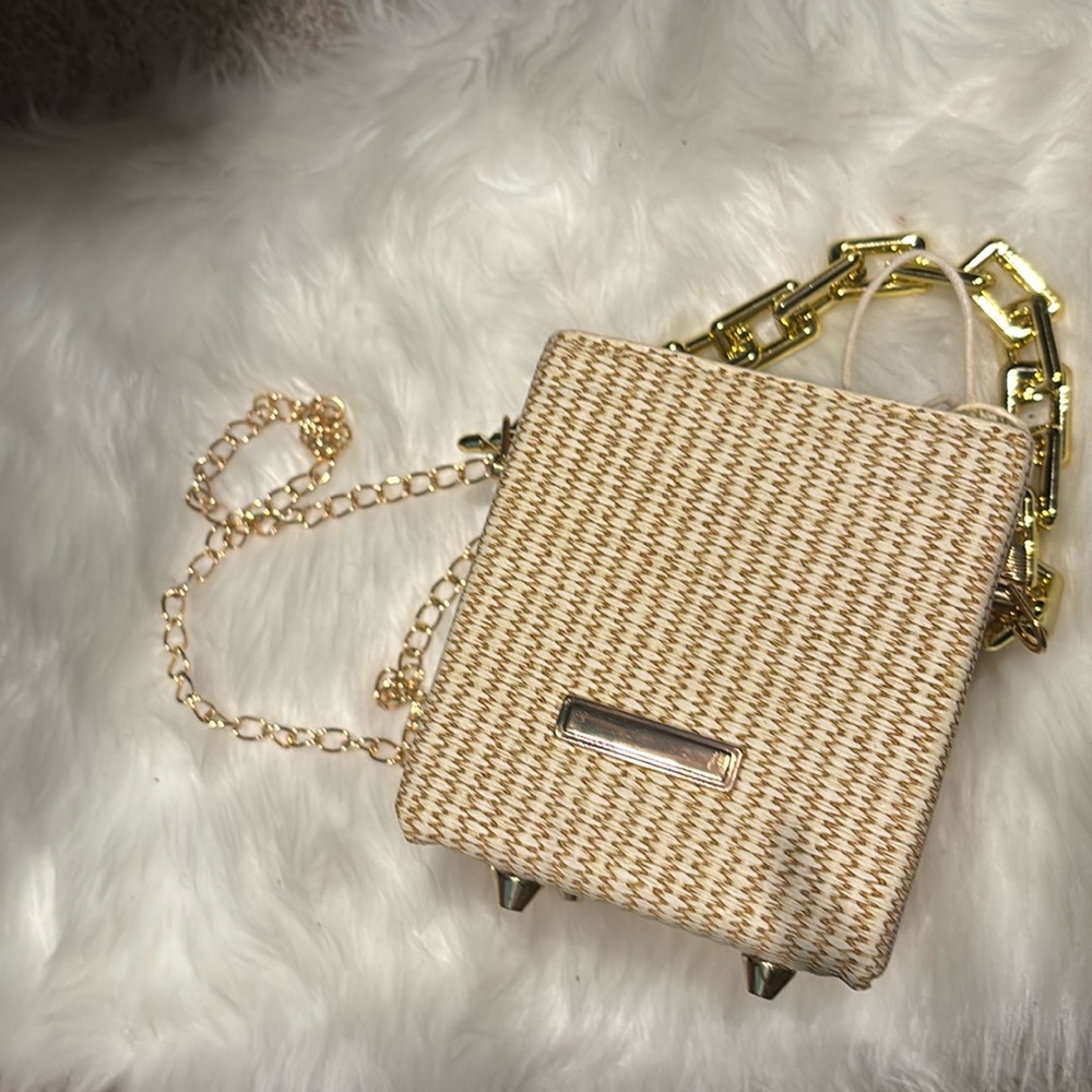 Brown woven bag with leather drawstring pouch